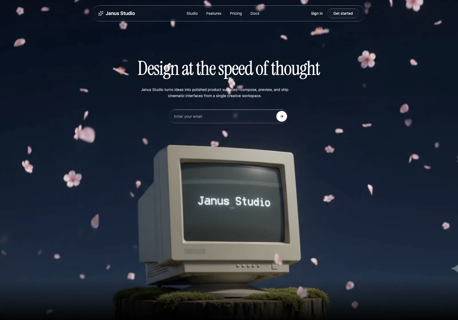 The finished site: a retro computer reading “Janus Studio” on a mossy stump under a night sky, pink petals falling behind a glass nav and the headline “Design at the speed of thought”