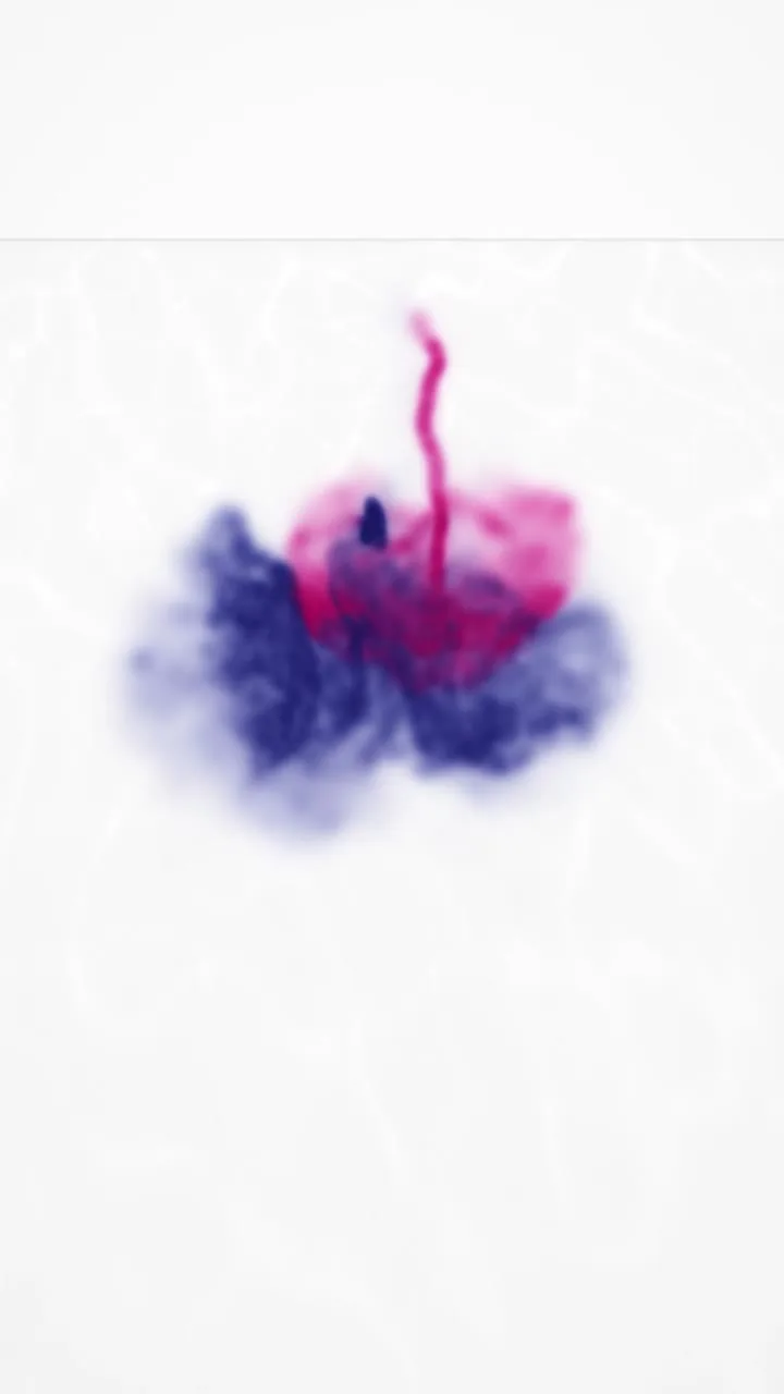 Indigo and magenta ink blooming in clear white water